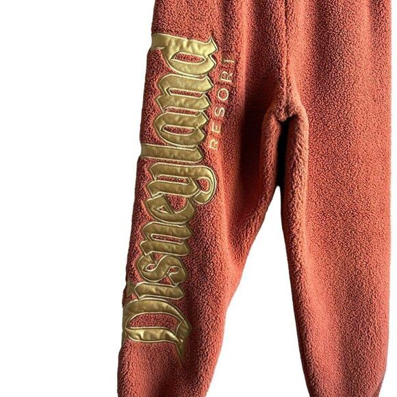Disney Spirit Sweat Pants Women's M Rust Pink Gold Spell Out Sherpa Fleece - Picture 3 of 8
